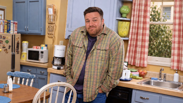 David Metcalf of DimesVault shrugging with hands in his pockets in a 90s sitcom kitchen — how much money do you need to start sports betting
