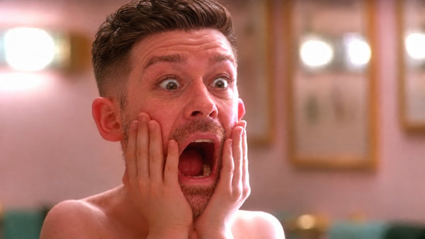 David Metcalf of DimesVault screaming hands-on-cheeks at a phone showing a lost bet — why did my bet lose if the team won